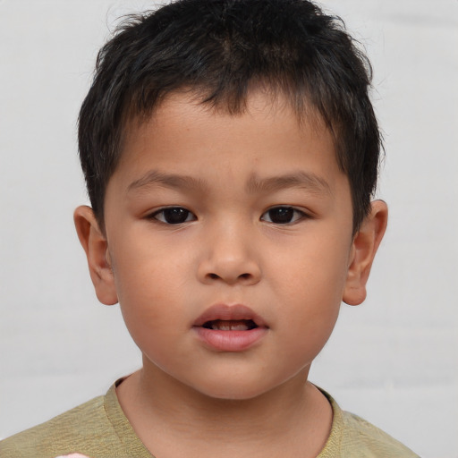 Neutral asian child male with short  brown hair and brown eyes