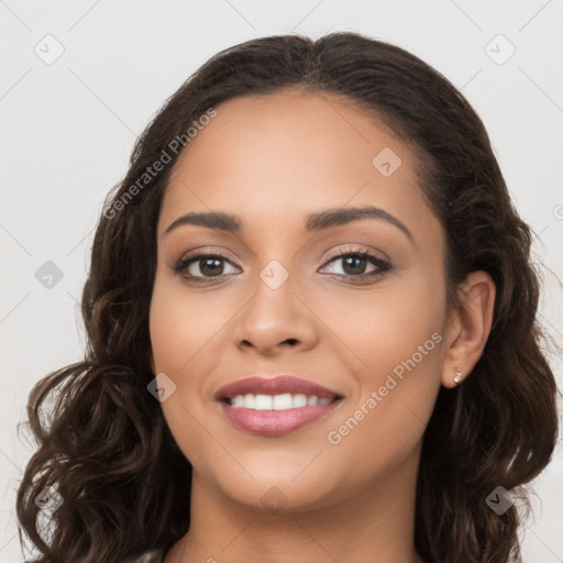 Joyful latino young-adult female with long  brown hair and brown eyes