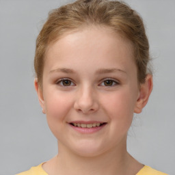 Joyful white child female with short  brown hair and brown eyes