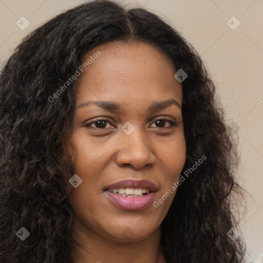 Joyful black young-adult female with long  brown hair and brown eyes