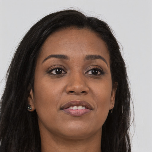 Joyful asian young-adult female with long  brown hair and brown eyes