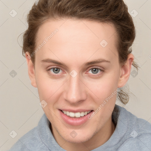 Joyful white young-adult female with short  brown hair and grey eyes