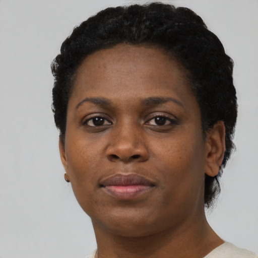 Neutral black young-adult female with short  black hair and brown eyes
