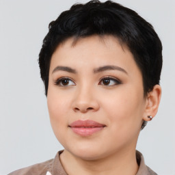 Joyful asian young-adult female with short  black hair and brown eyes