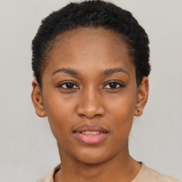 Joyful black young-adult female with short  brown hair and brown eyes