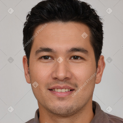 Joyful asian young-adult male with short  brown hair and brown eyes