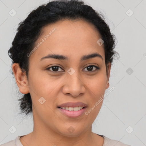 Joyful latino young-adult female with medium  brown hair and brown eyes