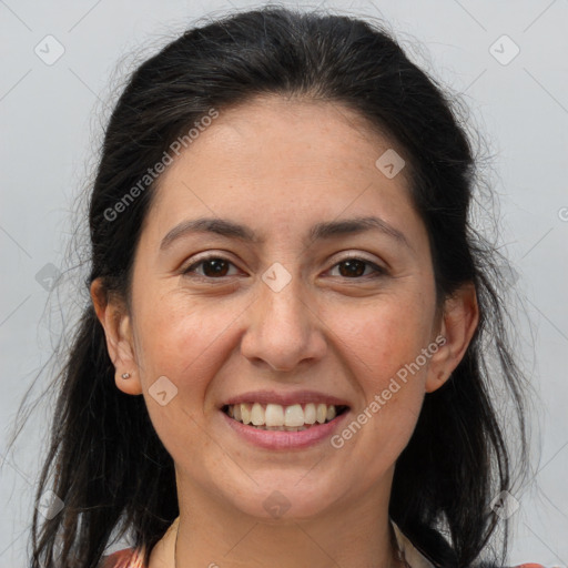 Joyful white adult female with long  brown hair and brown eyes