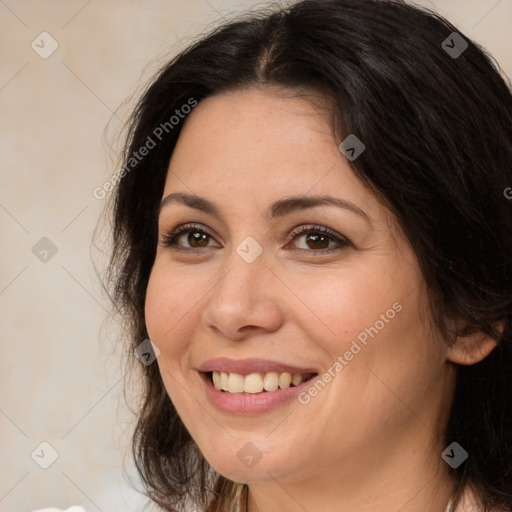 Joyful white adult female with medium  brown hair and brown eyes