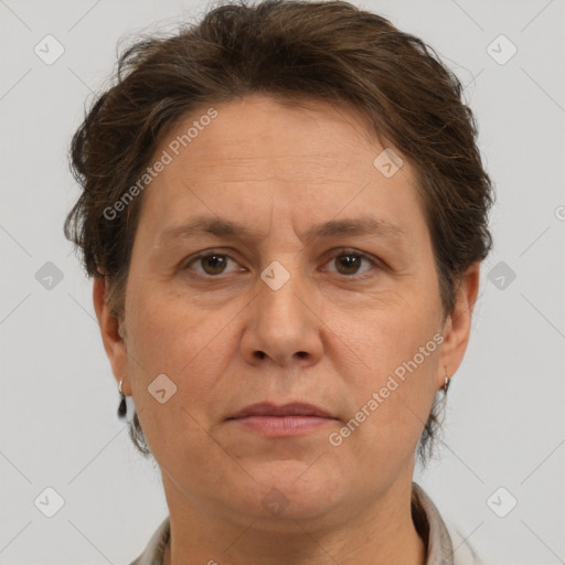 Joyful white adult female with short  brown hair and brown eyes