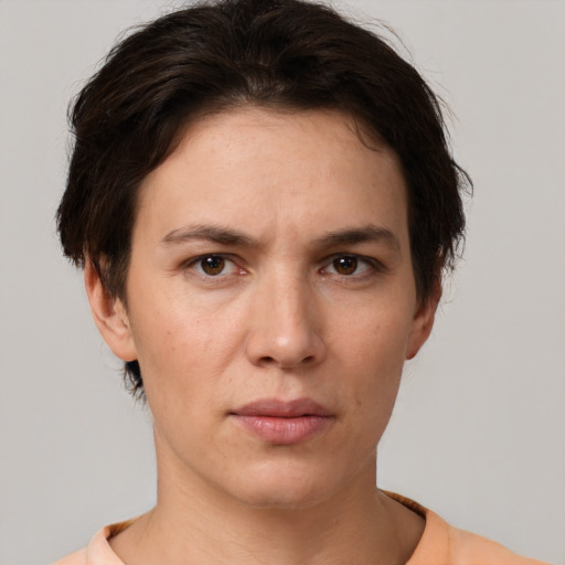 Neutral white young-adult female with short  brown hair and brown eyes