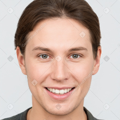 Joyful white young-adult female with short  brown hair and grey eyes