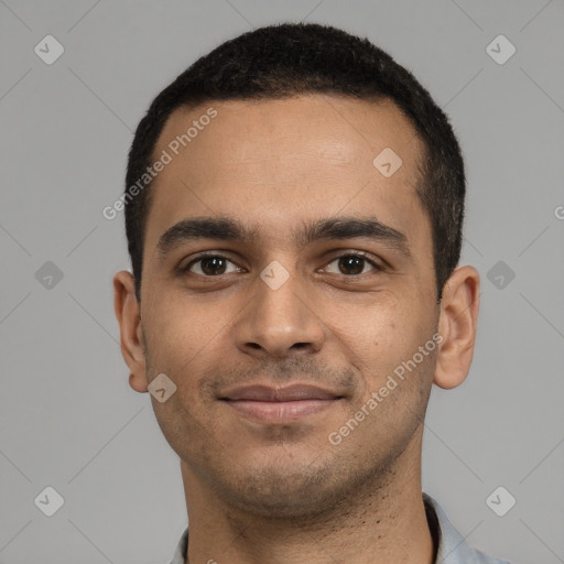 Joyful latino young-adult male with short  black hair and brown eyes