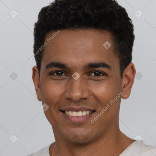 Joyful latino young-adult male with short  black hair and brown eyes
