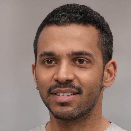 Neutral black young-adult male with short  black hair and brown eyes