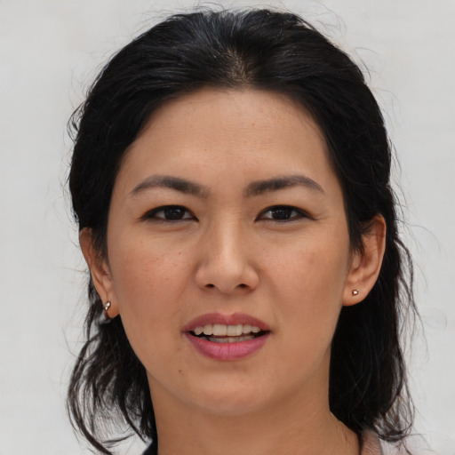 Joyful asian young-adult female with medium  black hair and brown eyes