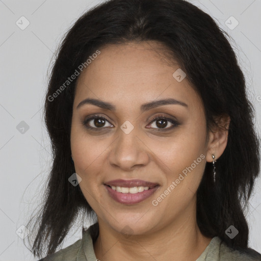 Joyful black young-adult female with long  brown hair and brown eyes