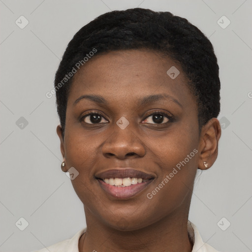 Joyful black young-adult female with short  black hair and brown eyes