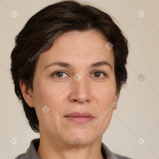 Joyful white adult female with short  brown hair and brown eyes