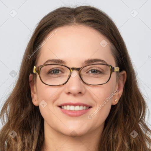 Joyful white young-adult female with long  brown hair and blue eyes