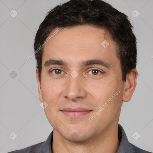 Joyful white adult male with short  brown hair and brown eyes