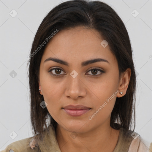 Joyful latino young-adult female with long  brown hair and brown eyes