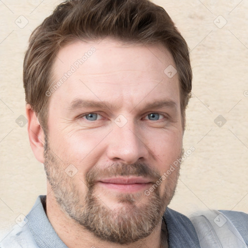 Joyful white adult male with short  brown hair and grey eyes