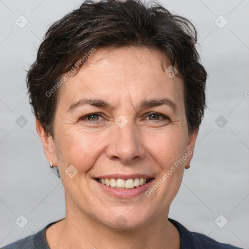 Joyful white adult female with short  brown hair and brown eyes