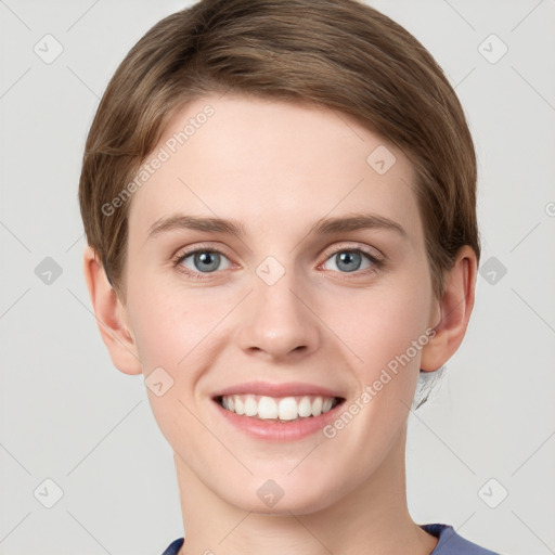 Joyful white young-adult female with short  brown hair and grey eyes