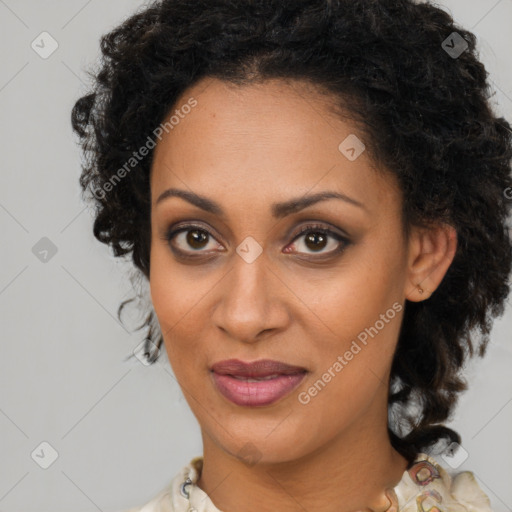 Joyful black young-adult female with medium  brown hair and brown eyes