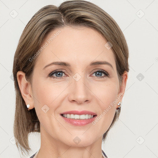 Joyful white adult female with medium  brown hair and grey eyes