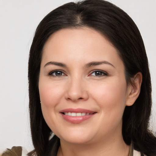 Joyful white young-adult female with medium  brown hair and brown eyes