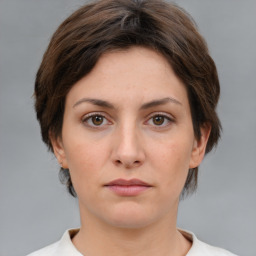 Neutral white young-adult female with medium  brown hair and brown eyes