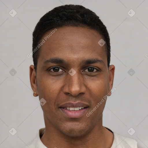 Joyful black young-adult male with short  black hair and brown eyes