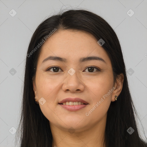 Joyful latino young-adult female with long  brown hair and brown eyes