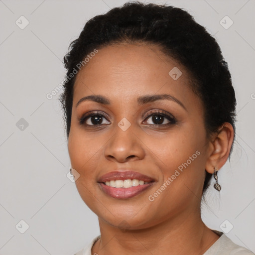 Joyful latino young-adult female with short  black hair and brown eyes