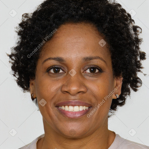 Joyful black adult female with short  brown hair and brown eyes