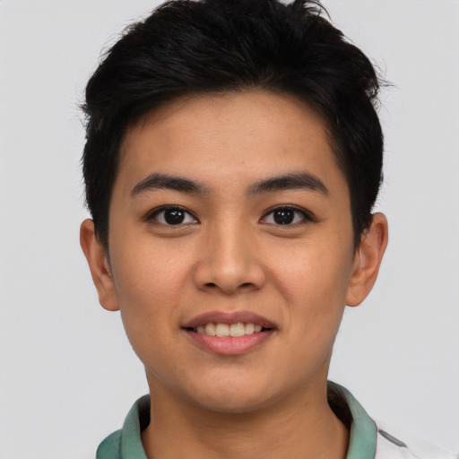 Joyful asian young-adult male with short  black hair and brown eyes