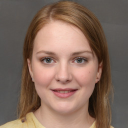 Joyful white young-adult female with medium  brown hair and blue eyes