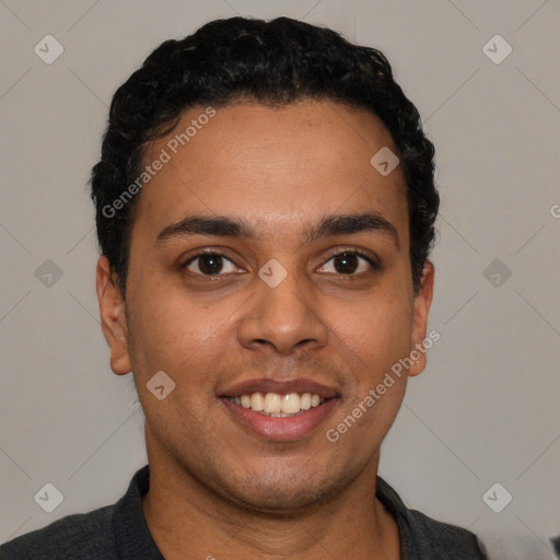 Joyful white young-adult male with short  black hair and brown eyes