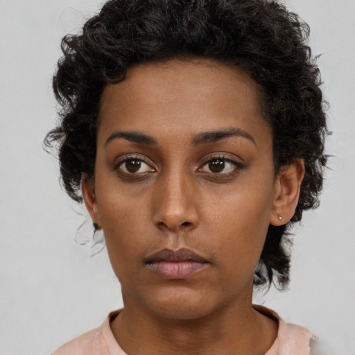 Neutral black young-adult female with short  brown hair and brown eyes