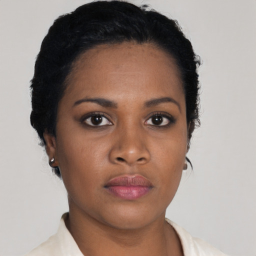 Neutral black young-adult female with short  black hair and brown eyes