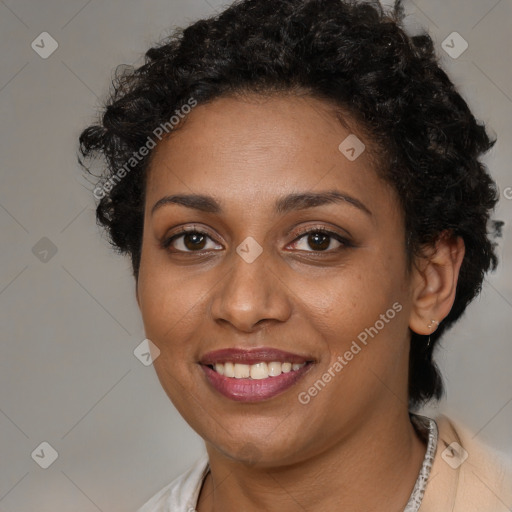 Joyful black young-adult female with short  brown hair and brown eyes