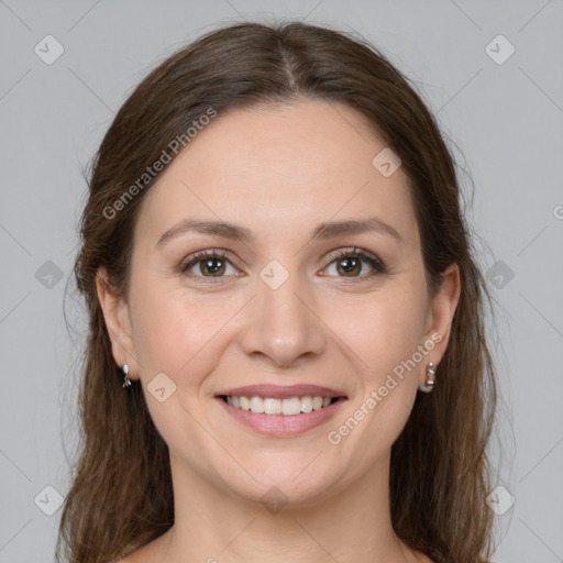 Joyful white young-adult female with medium  brown hair and grey eyes