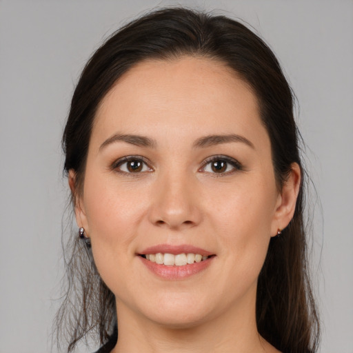 Joyful white young-adult female with medium  brown hair and brown eyes