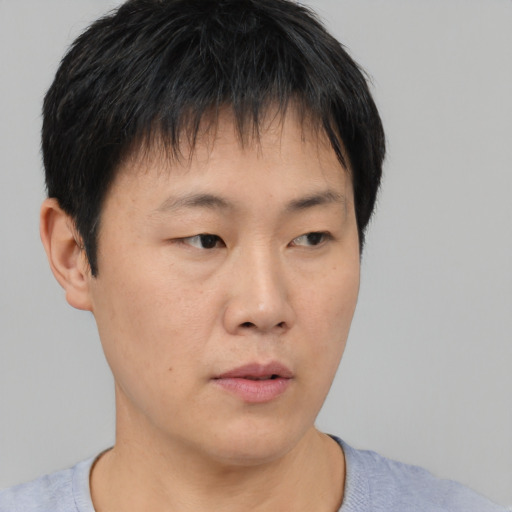 Neutral asian young-adult male with short  black hair and brown eyes