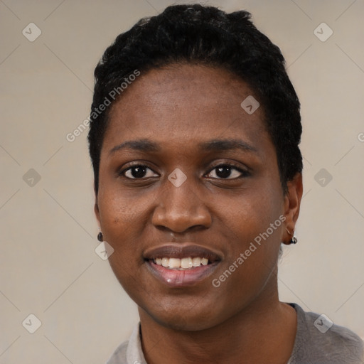 Joyful black young-adult female with short  black hair and brown eyes