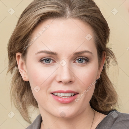 Joyful white young-adult female with medium  brown hair and blue eyes