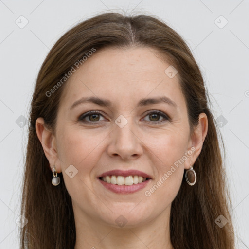 Joyful white adult female with long  brown hair and grey eyes