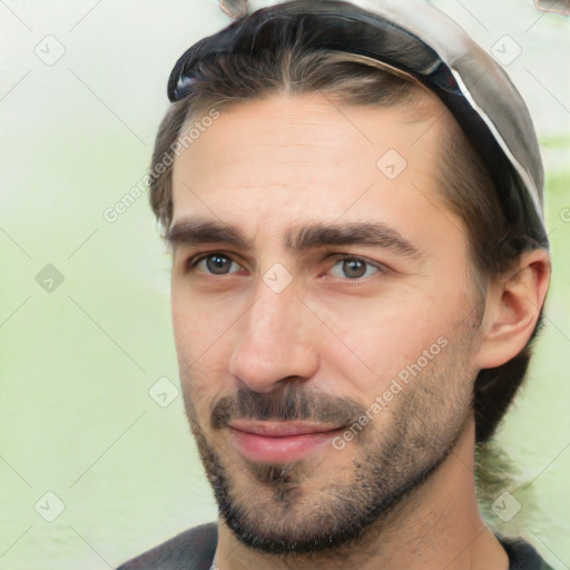 Joyful white young-adult male with short  black hair and brown eyes